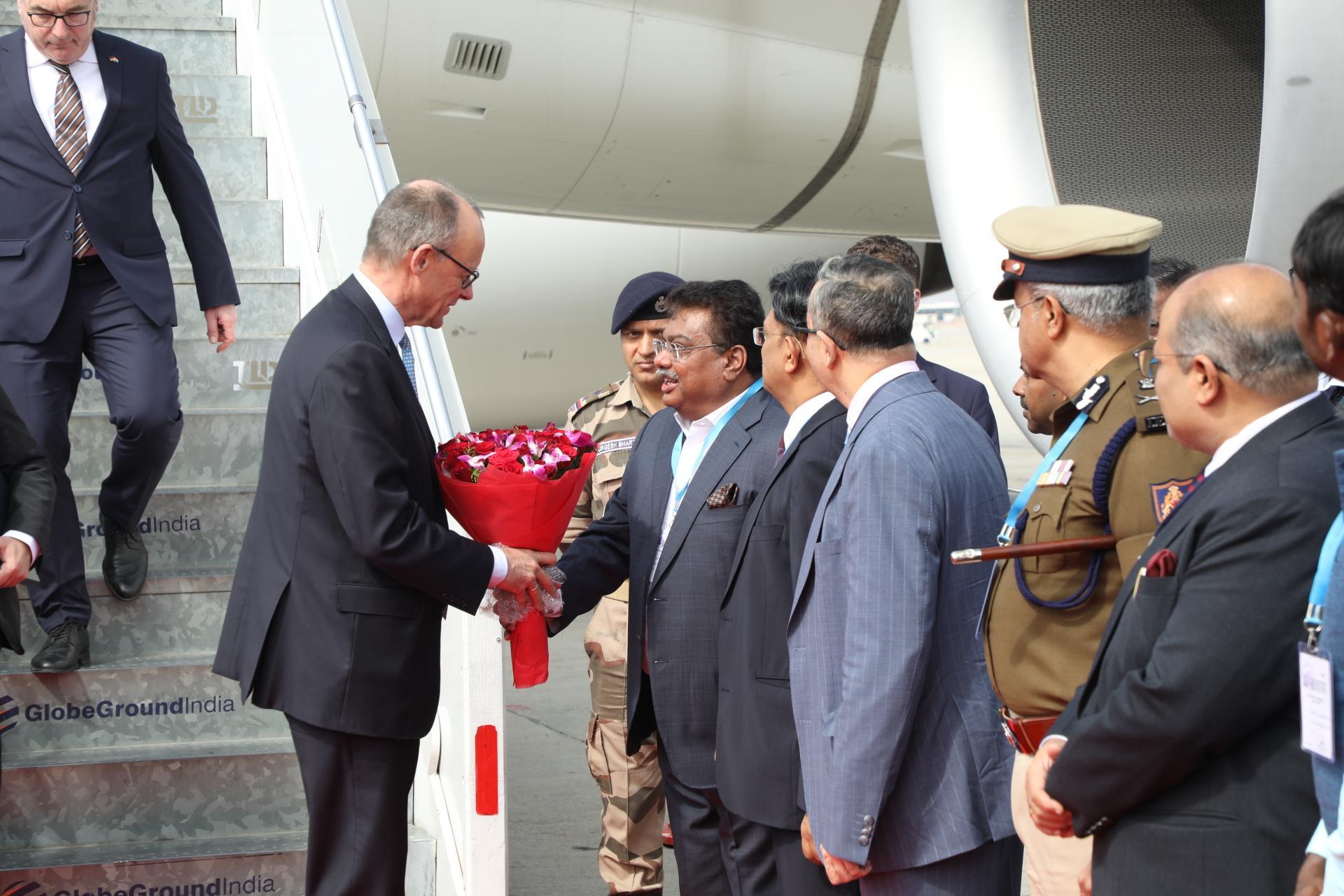 K'taka govt sees off German Chancellor; BJP objects to CM's absence