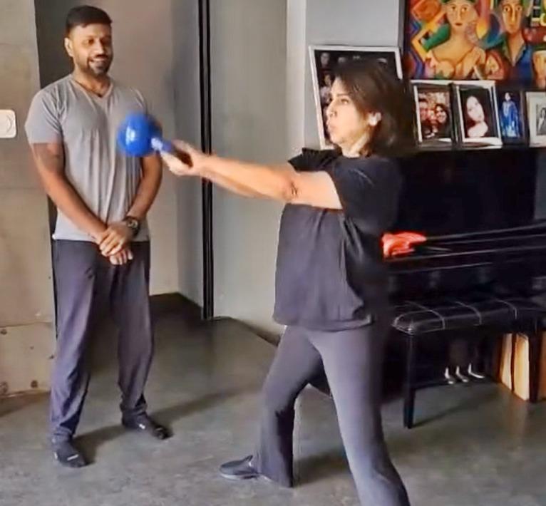 Neetu Kapoor does 10 kettlebell swings before yoga
