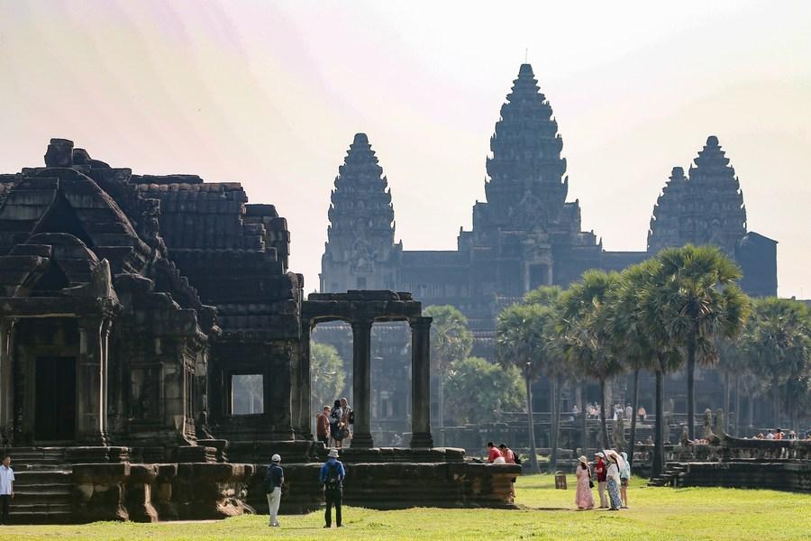 Huge crowds of tourists enjoy equinox sunrise at Cambodia's iconic Angkor Wat