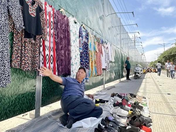 A man sells shoes on the outside in Kashgar, the Xinjiang Uygur Autonomous Region