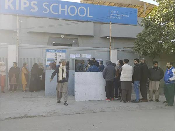 People waiting to vote at Lahore Johar Town