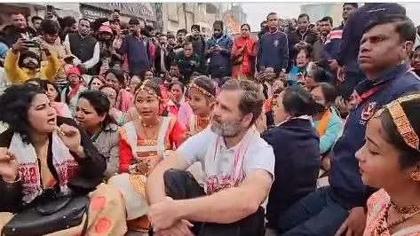 Rahul Gandhi and other Congress leaders staging a sit-in outside the Batadrava Than holy shrine