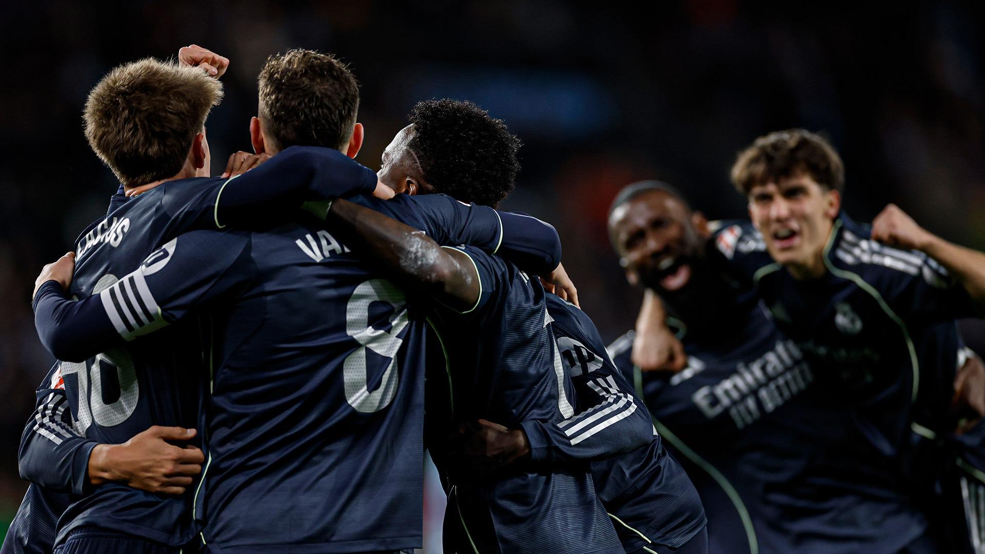 Real Madrid stays in title race as deflected goal gives late win in Vigo