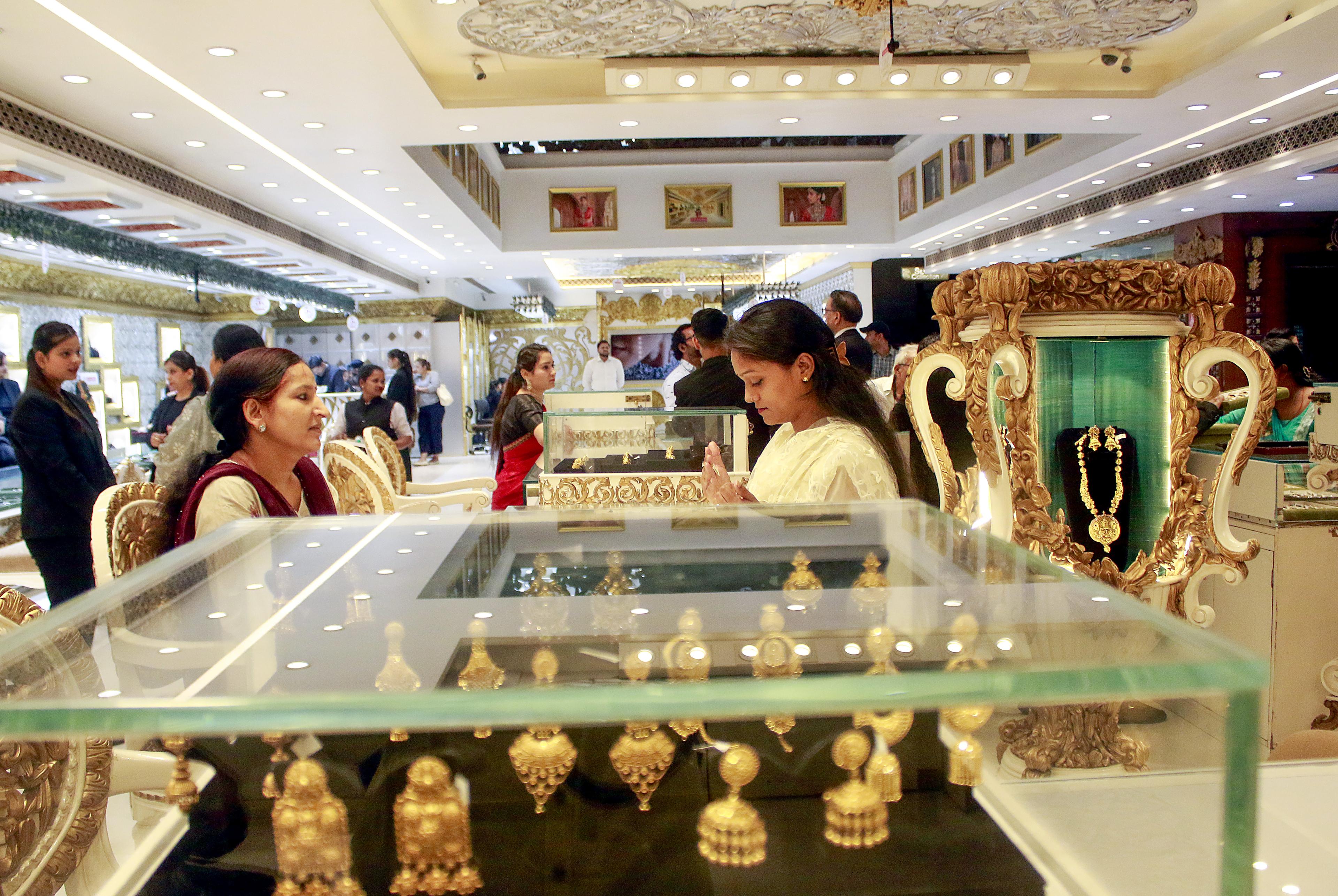 Gold prices drop sharply by Rs 2,375 per 10 grams; silver also falls