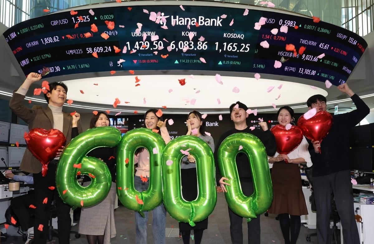 Seoul stocks jump nearly 2 pc to top 6,000 milestone on chip rally