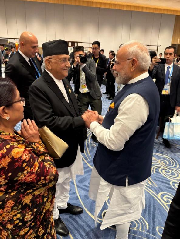 PM Modi meets Nepal's counterpart Oli, calls ties 'deep-rooted, special'